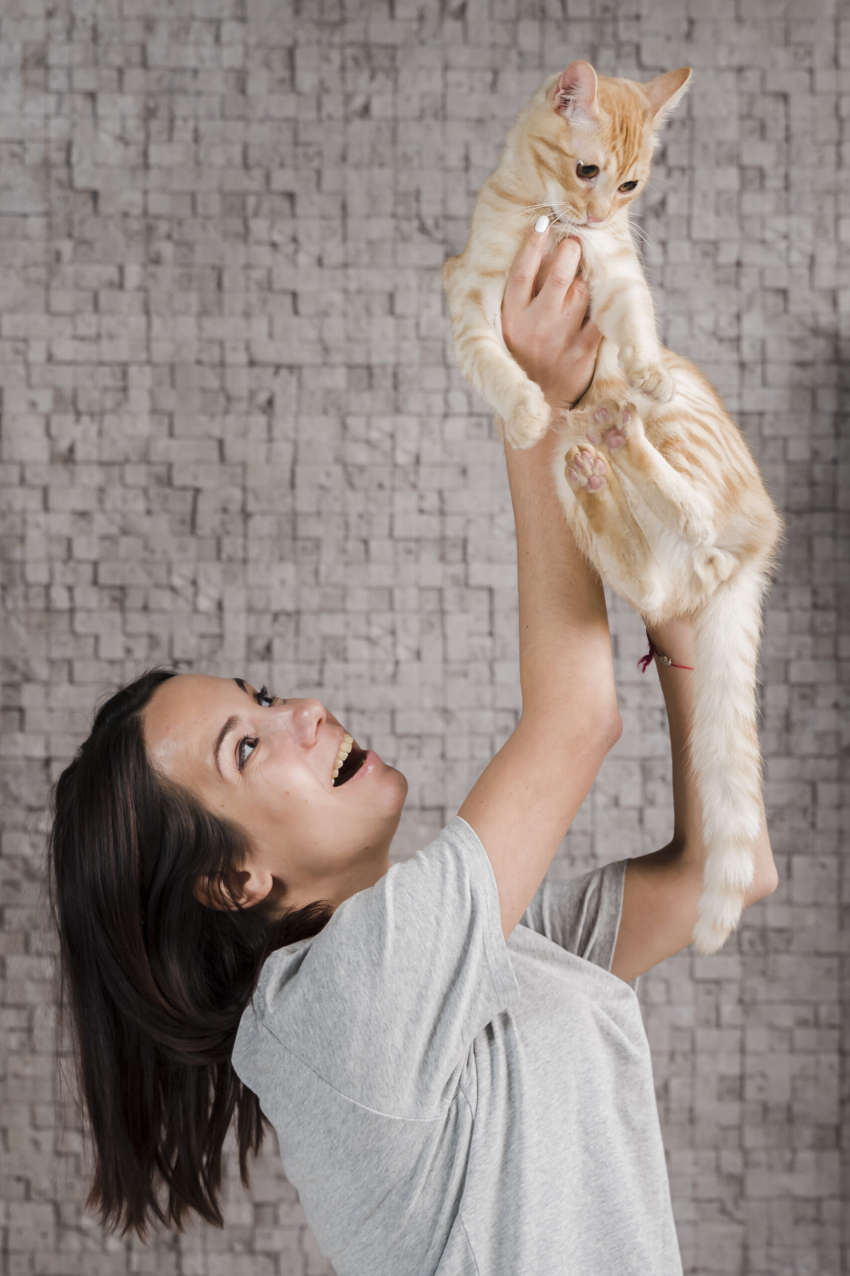 portrait-young-woman-holding-family-cat