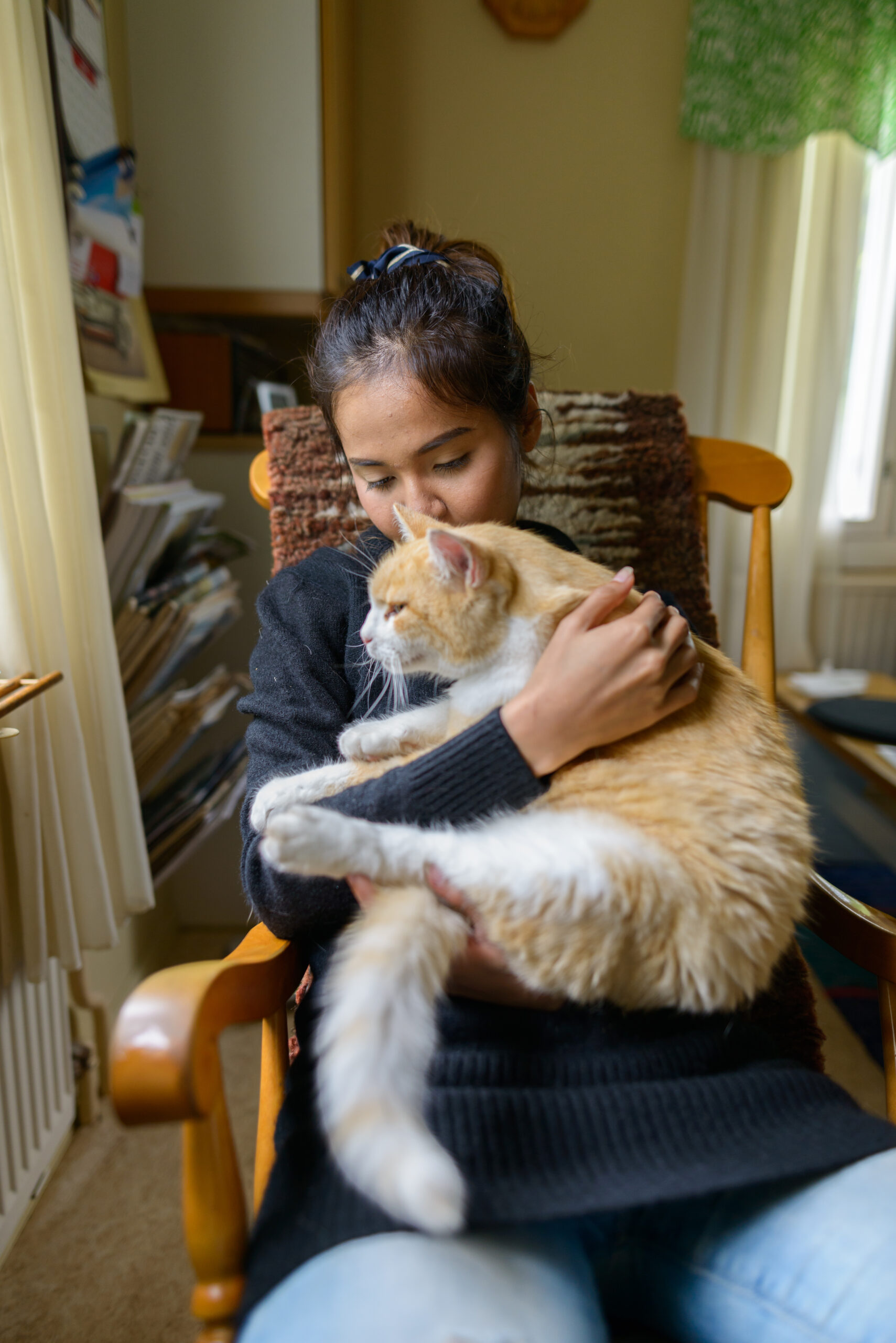 Portrait of young beautiful Asian woman at home indoors