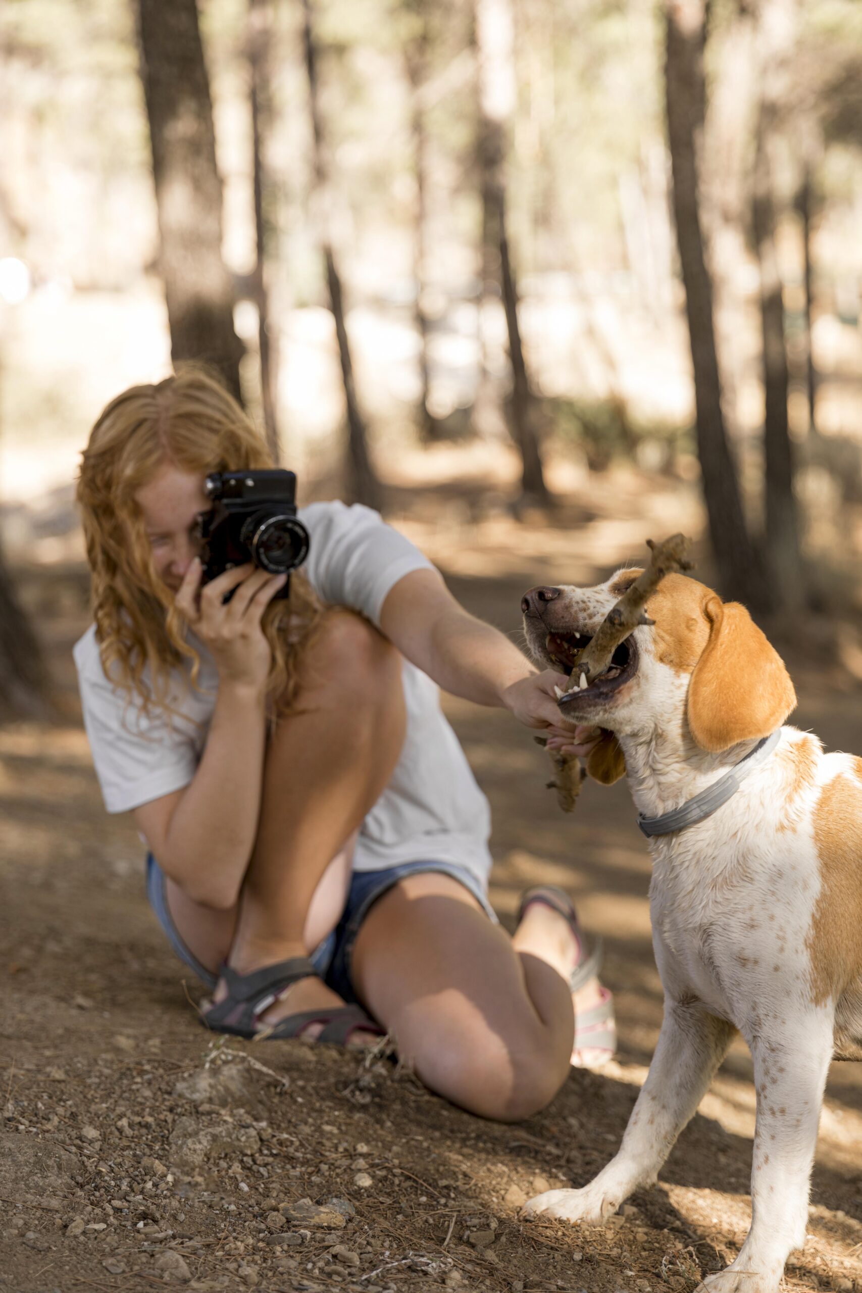 woman-taking-pictures-her-dog-long-view